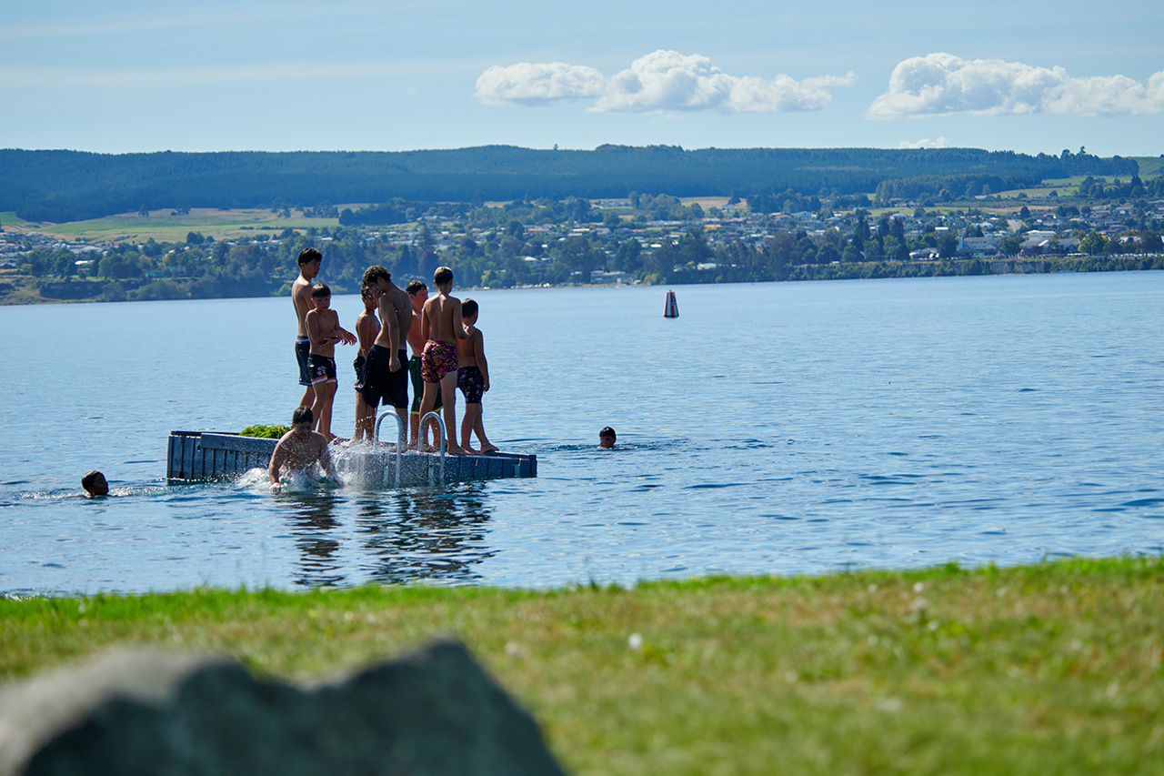 Kids jumping into lake